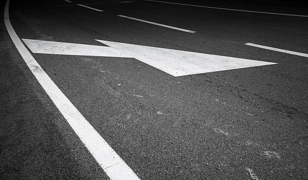 istock Road marking with white lines and arrows 467083683