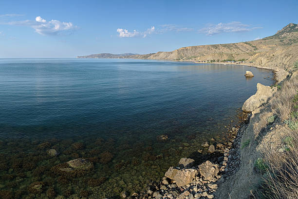 Lisya bay in Crimea, Ukraine View of Lisya bay (Fox bay) with tent camp under the Echki-dag mountains and Meganom peninsula in Crimea, Ukraine lisya bay stock pictures, royalty-free photos & images