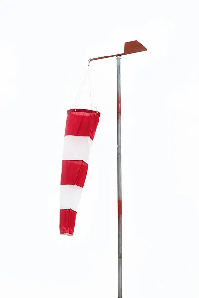 wind sock hanging down in a no wind day white background