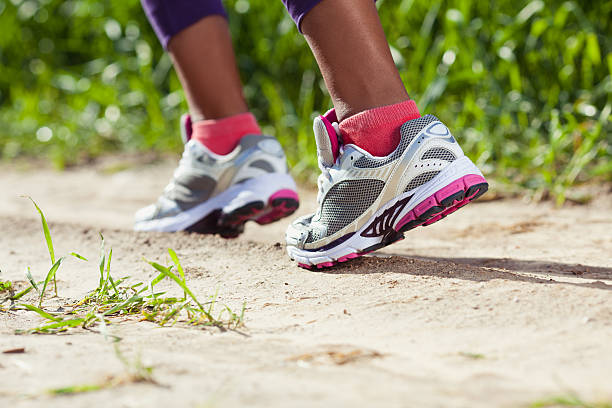 istock Walking/running legs sport shoes. 467085554