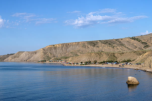 Tent camp in Lisya bay, Crimea Tent camp in Lisya bay (Fox bay) under the Echki-Dag Mountains in Crimea, Ukraine lisya bay stock pictures, royalty-free photos & images