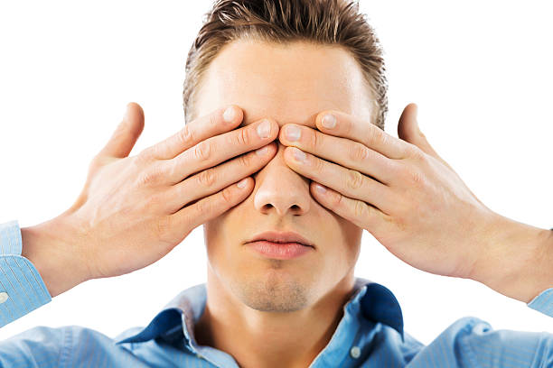 istock Young man covering his eyes. 467088281