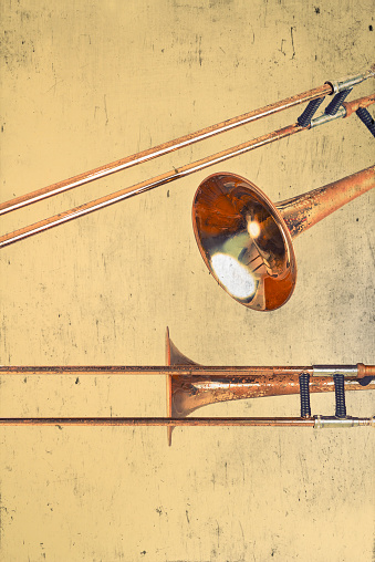 Rusty Trombones in grunge style textured musical background