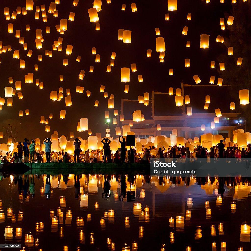 Mass Sky Lantern Release People release sky lanterns to pay homage to the triple gem: Budhha, Dharma and Sangha during Yi Peng festival. Lantern Stock Photo