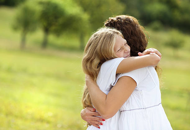 istock Mother and daughter hugging 467091635