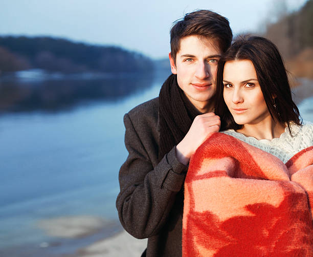 Outdoor cold spring portrait of young attractive couple stock photo