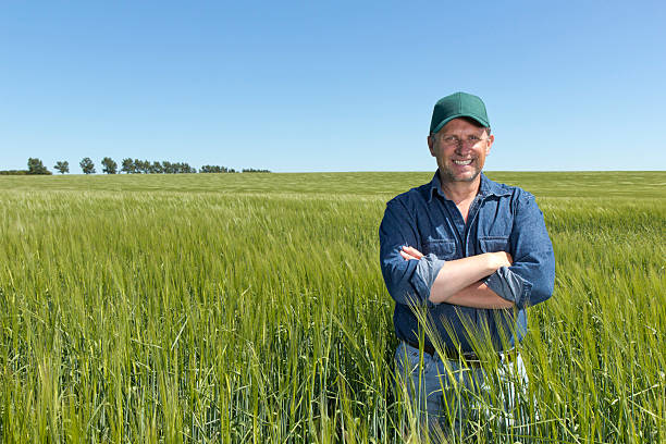 istock Postive Farmer at his Farm in a Wheat Field 467093450