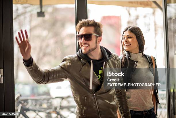 Young Couple Arriving At Coffee Shop Stock Photo - Download Image Now - Cafe, Entering, Beautiful People