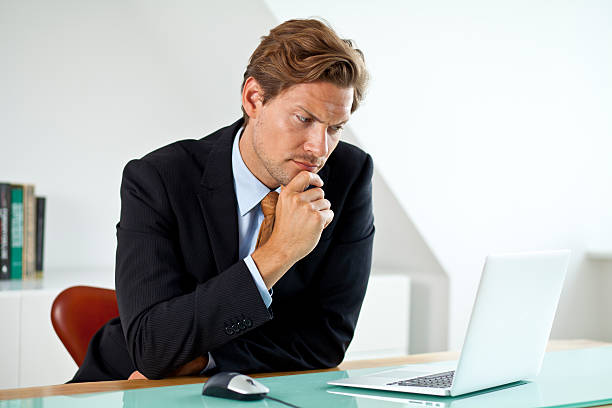 istock Concerned Businessman in front of laptop 467093891