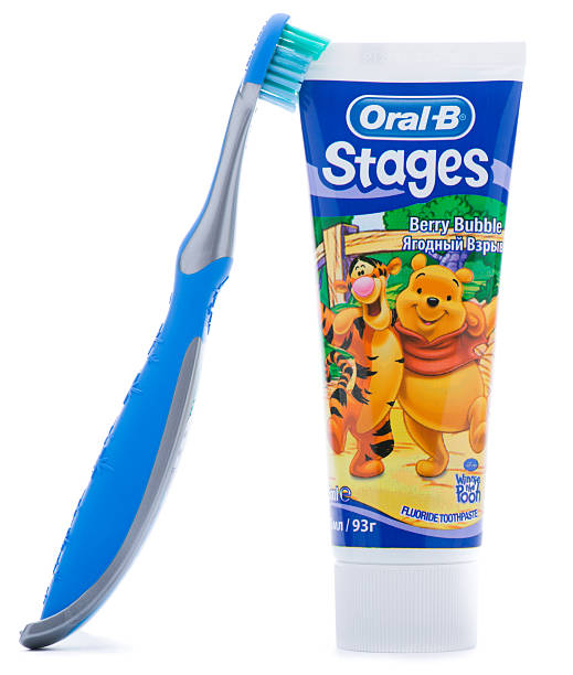 Oral B Toothpaste and Toothbrush Ankara, Turkey - May 28, 2013: Oral-B is a brand of oral hygiene products, including toothbrushes, toothpastes, mouthwashes and dental floss. Oral B toothpastes and toothbrushes with designs featuring fun Disney characters that helps make brushing fun for children. winnie the pooh photos stock pictures, royalty-free photos & images