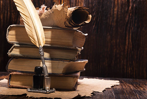 istock Vintage golden pen and ancient manuscripts 467097090