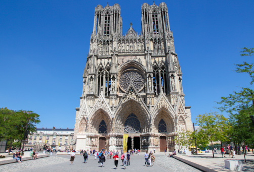 Reims, France - July 3, 2011: Unidentified people near Reims Cathedral in Champagne region, France.