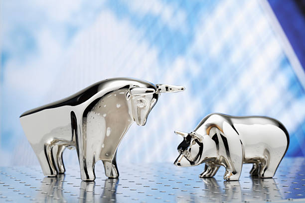 istock Bull and bear, high-rise building in the background 467100356