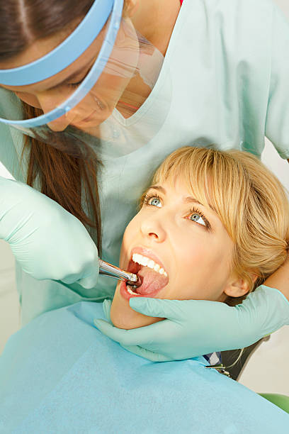 istock Dentistry Tooth  Extraction   Dentist working  Dental Tooth  Extraction Forceps 467100408