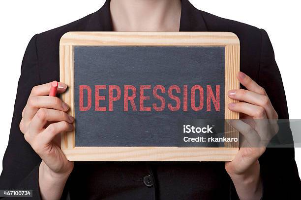 Woman Holding A Small Chalkboard With Depression Written Stock Photo - Download Image Now