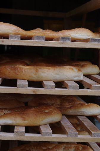 fresh baked pide bread in rack