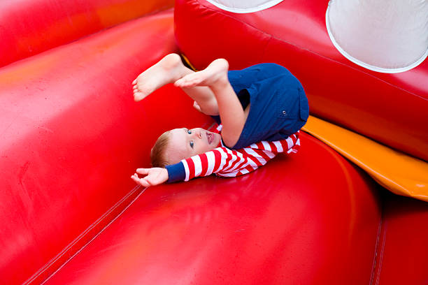 istock Four-year-old kid playing on a trampoline 467103787
