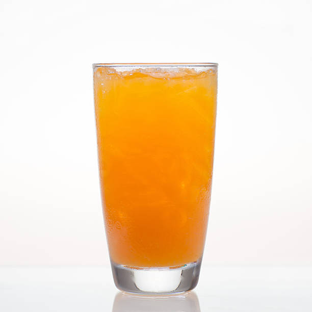 istock Orange juice with ice in glass isolated 467104464