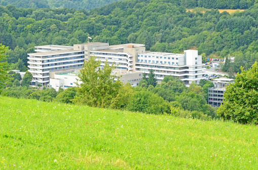 Public hospital building in forest valley