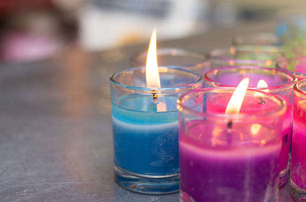 istock colorful burning candle in glasses 467106285
