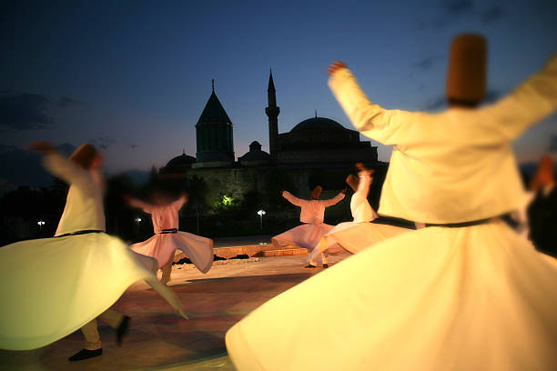 Rear view of people dancing outdoors at the Mevlana museum stock photo