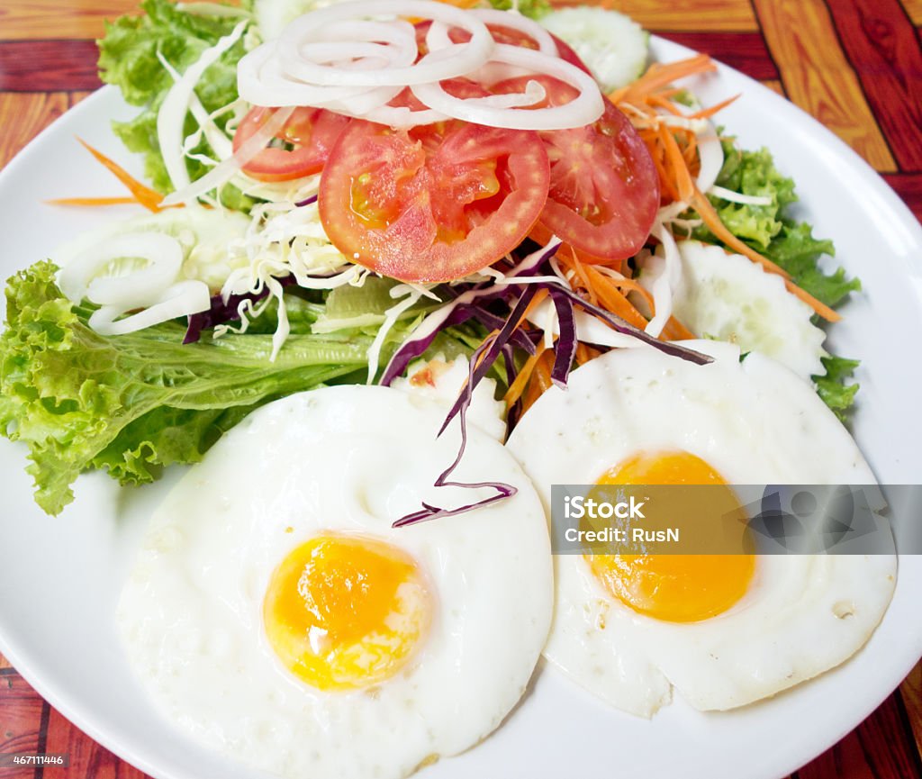 fried eggs fried eggs with fresh salad 2015 Stock Photo