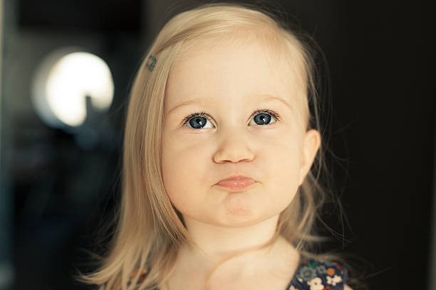 istock Adorable little girl looking up. 467114168
