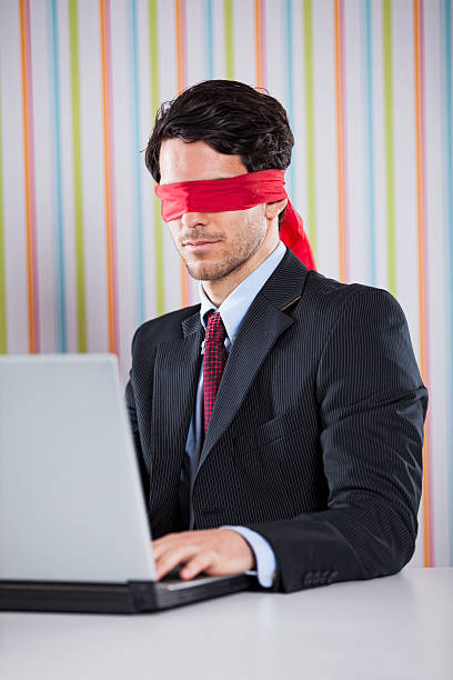 istock Blind businessman working at the office 467114314