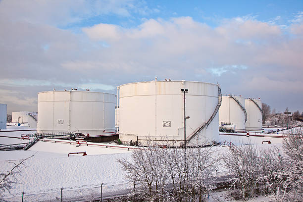 istock white tanks in tank farm with snow 467115351