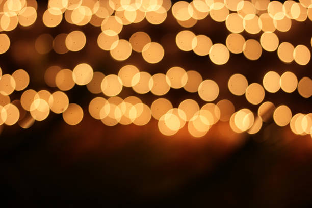 istock Out of focus yellow lights on dark background 467116874