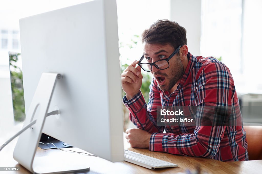 This is impossible! Shot of a young designer looking at his computer screen with shock and disbeliefhttp://195.154.178.81/DATA/istock_collage/a4/shoots/785247.jpg 20-29 Years Stock Photo