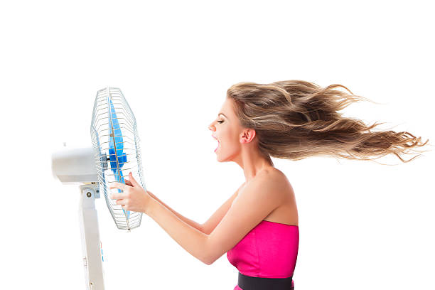 istock Girl with fan over white 467117565