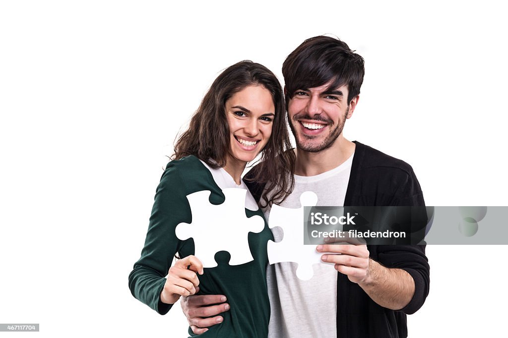 Teamwork A couple holding white pieces of puzzle 2015 Stock Photo