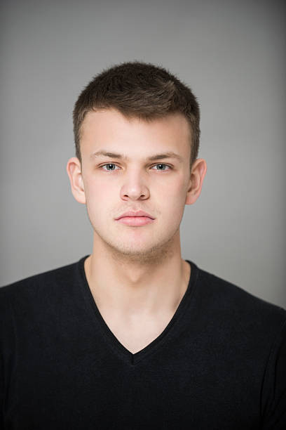 istock Serious Teenage Boy On Gray Background 467118086