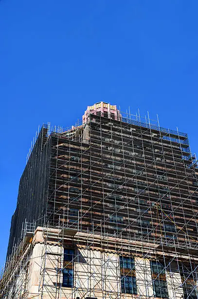 Extensive restoration progresses on the art-deco style architecture of the Asheville City Hall in North Carolina.  Scaffolding engulfs much of the buildings exterior.