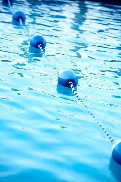 istock Blue water buoys in pool, shallow dof 467120429