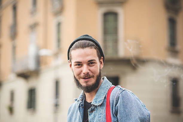 istock young handsome bearded hipster man smoking cigarette 467122308