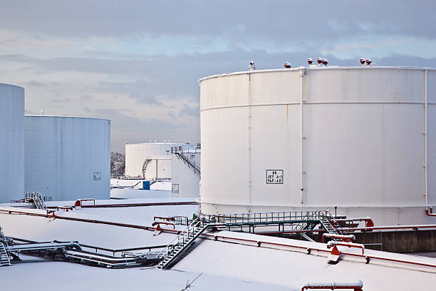 istock white tanks in tank farm with snow 467123475