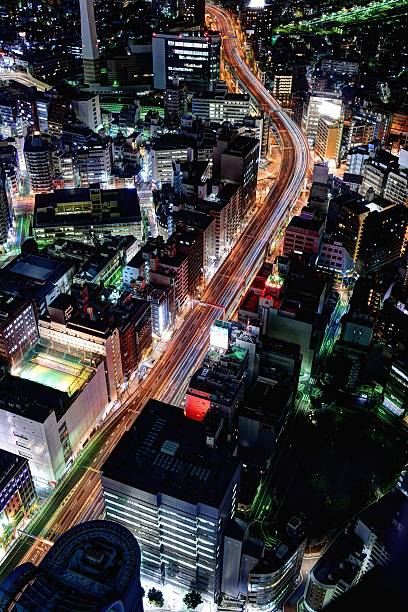 istock Greater Tokyo area dense building cityscape with car light trace 467125186
