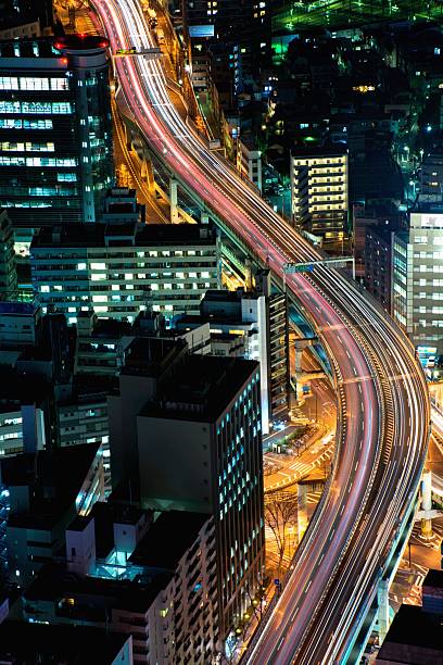 istock Greater Tokyo area dense building cityscape with car light trace 467125562