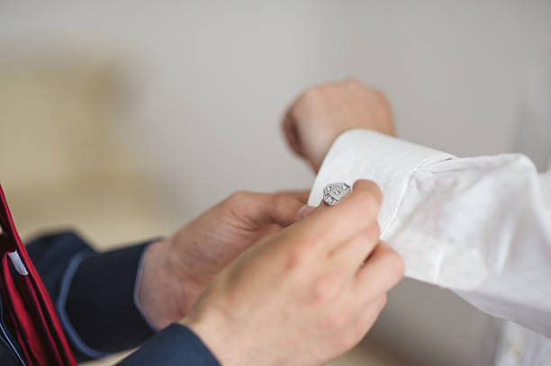 istock Groom is preparing Putting On Cufflinks 467127666
