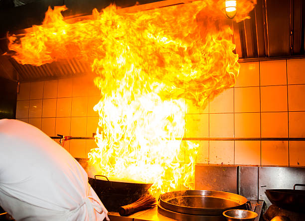 Fire burn cooking Fire gas burn is cooking on iron pan,stir fire very hot kitchen on fire stock pictures, royalty-free photos & images