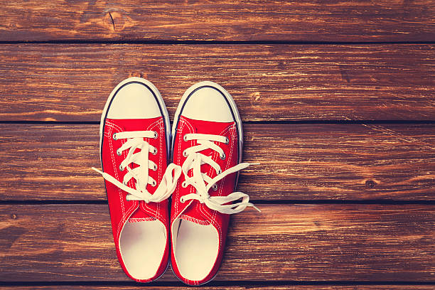 istock Red gumshoes with white shoelaces 467127688