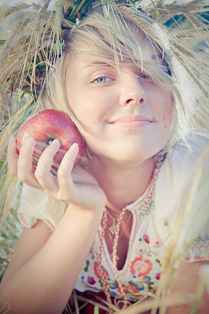 istock young woman on wheat field 467127785