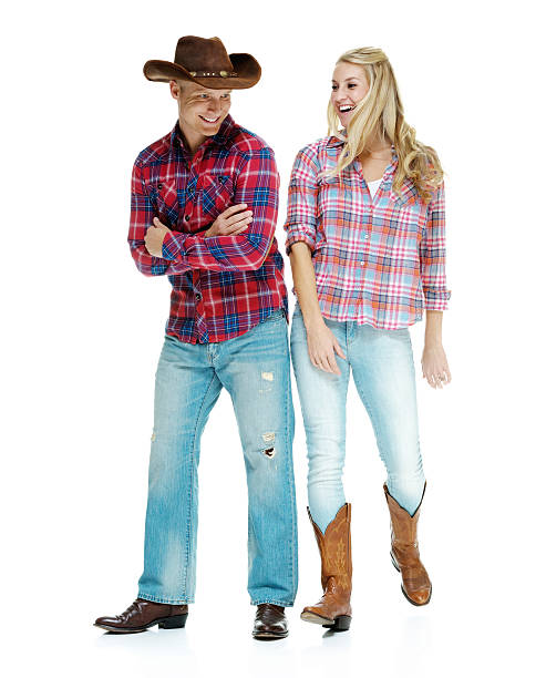 istock Smiling cowboy couple standing 467128157