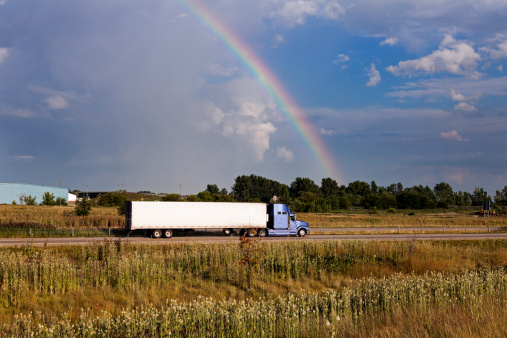 Semi truck driving under the rainbow - Chicago, Illinois.