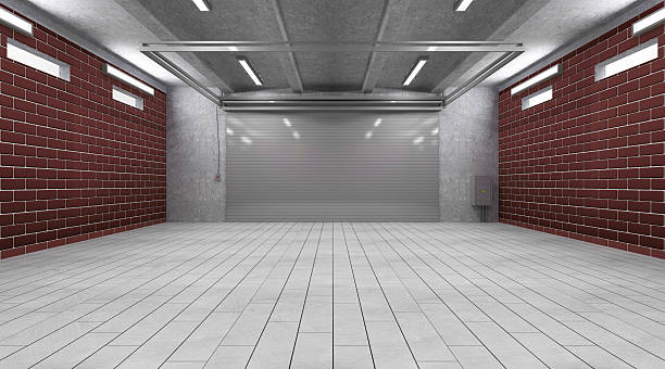 istock 3D interior of a garage with a roller door and brick walls 467128794
