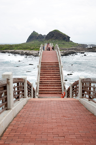 Taitung, Taiwan - November 16, 2014: Visitors cross the Sansiantai Dragon Bridge to Sanxiantai Island, Taitung, Taiwan