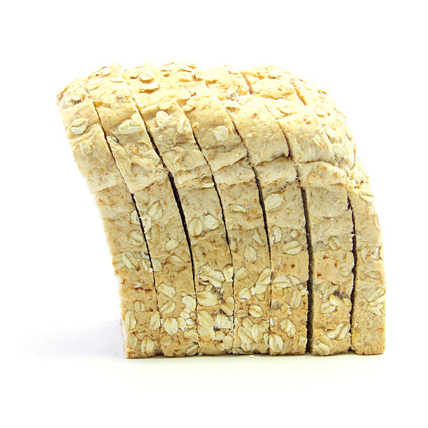 istock Whole wheat and oat bread sliced side view 467128874