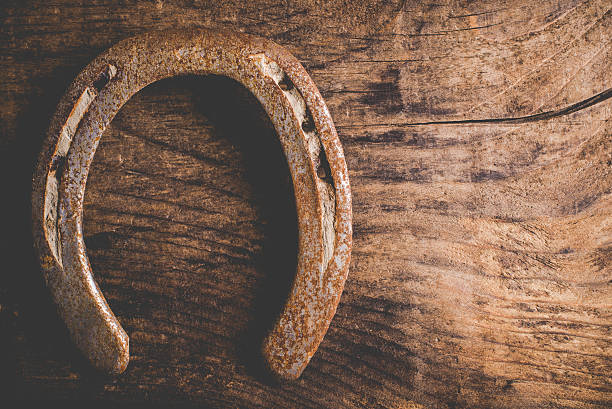 istock horseshoes on wood 467128906